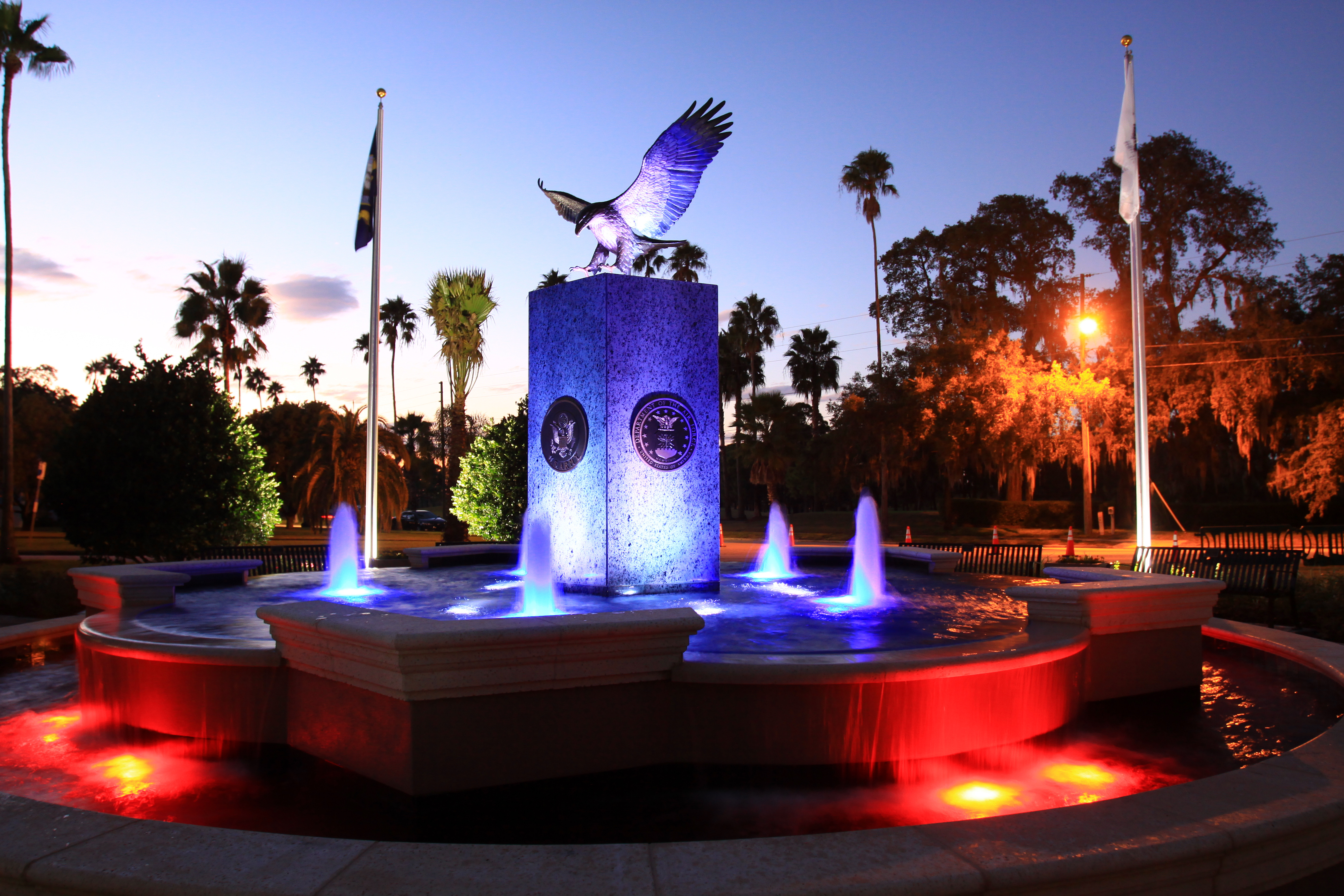 Hunter Memorial Park's fountain at sunset with fountain lights shining up on it