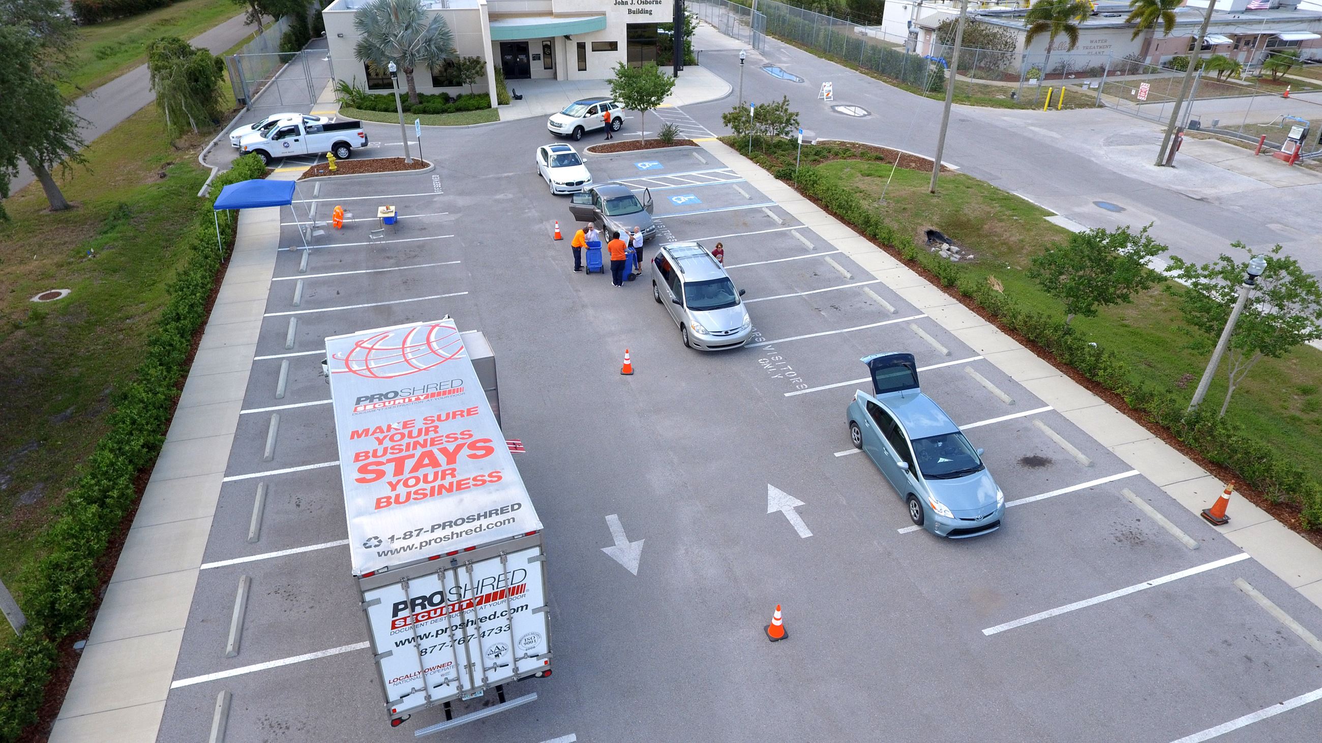 Aerial picture of a previous year shredding event. Vehicles are pulling through the drop off line.