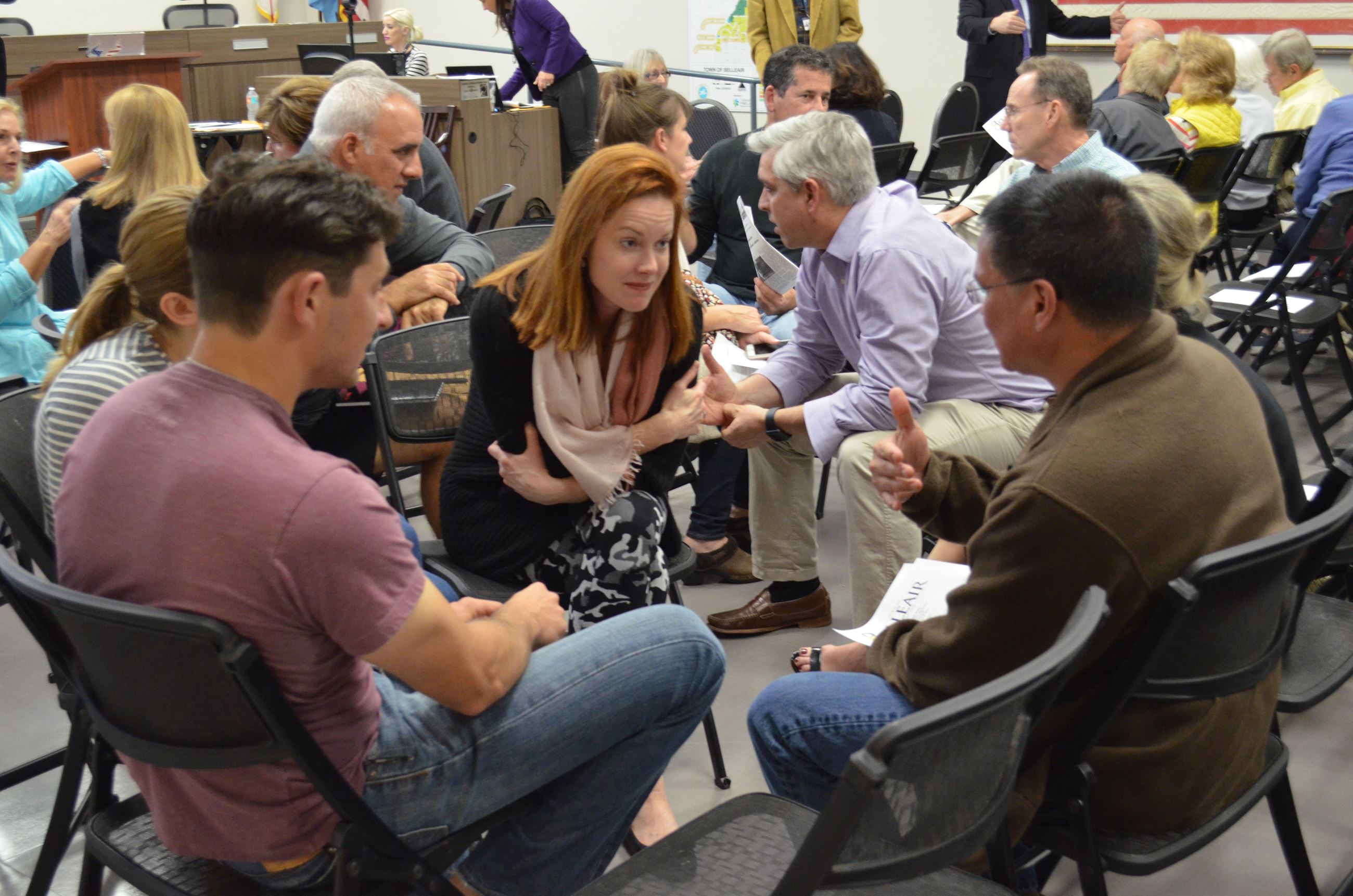A group of residents discuss their thoughts on Hallett Park at a strategic planning meeting