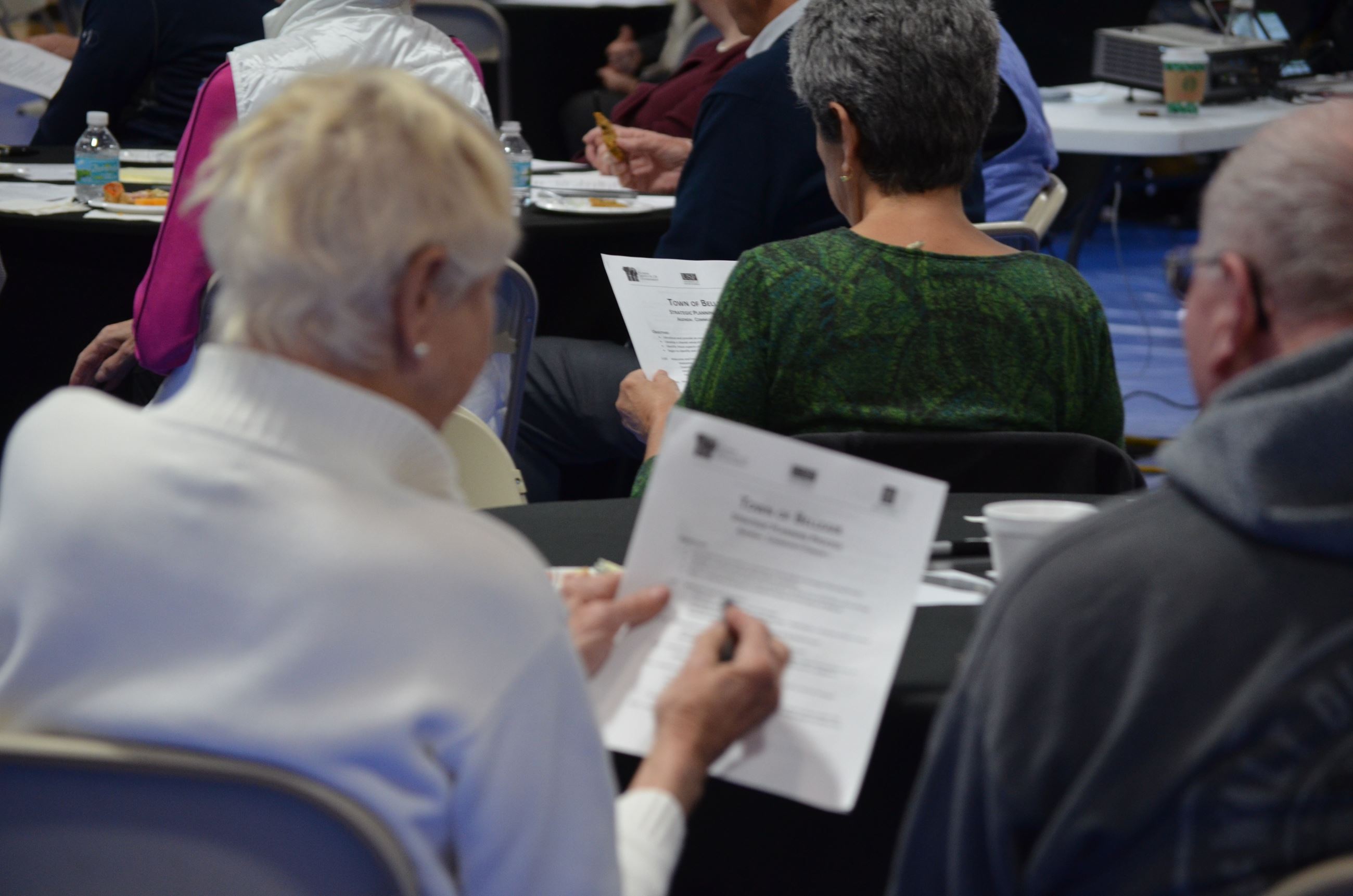 Residents review handouts provided at Community Forum 1