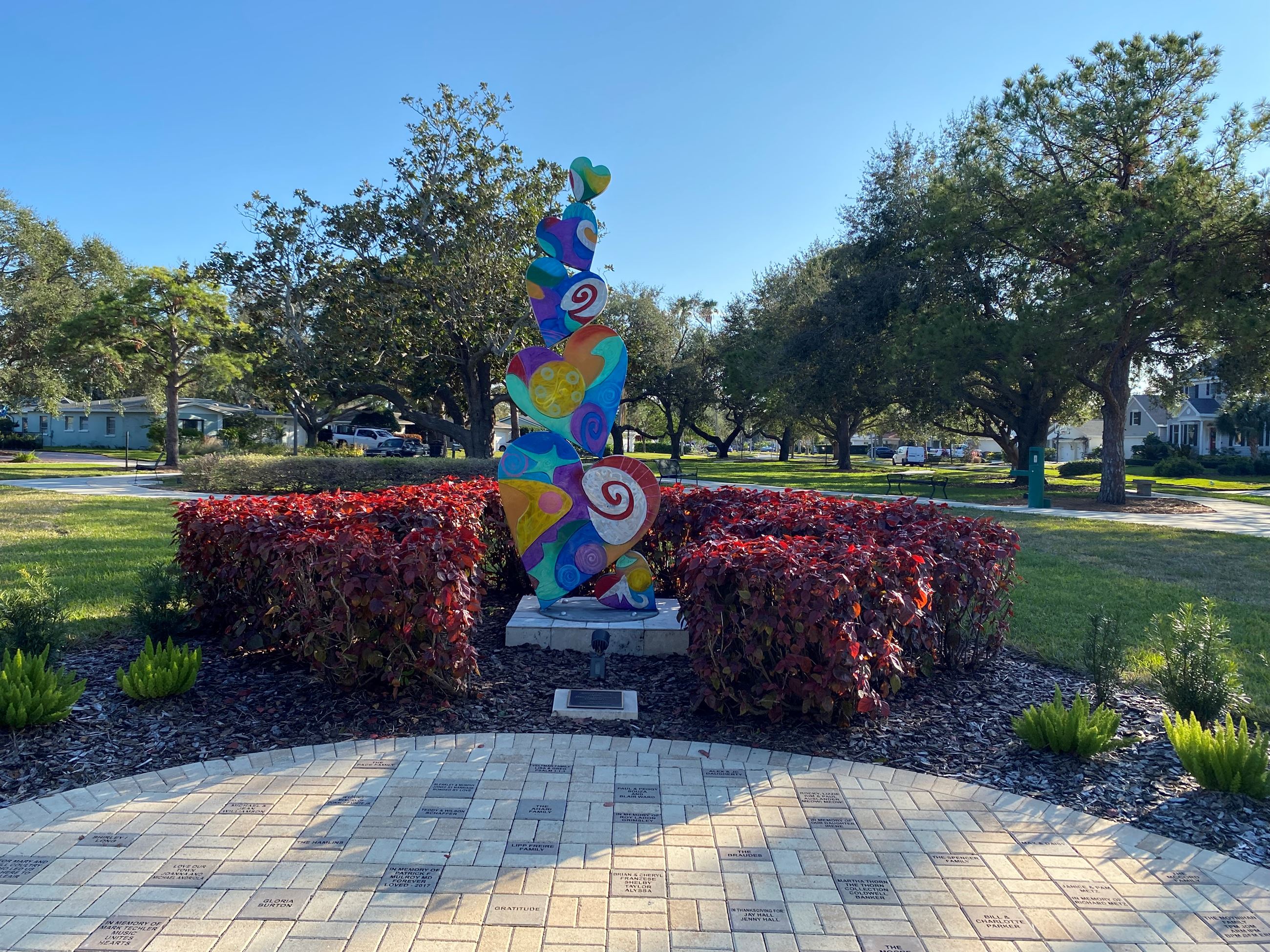 A multi-colored heart sculpture at the entrance of Doyle Park